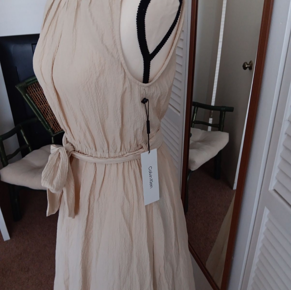 Brand new with Tags Calvin  Klein tea lenth dress.                A6
